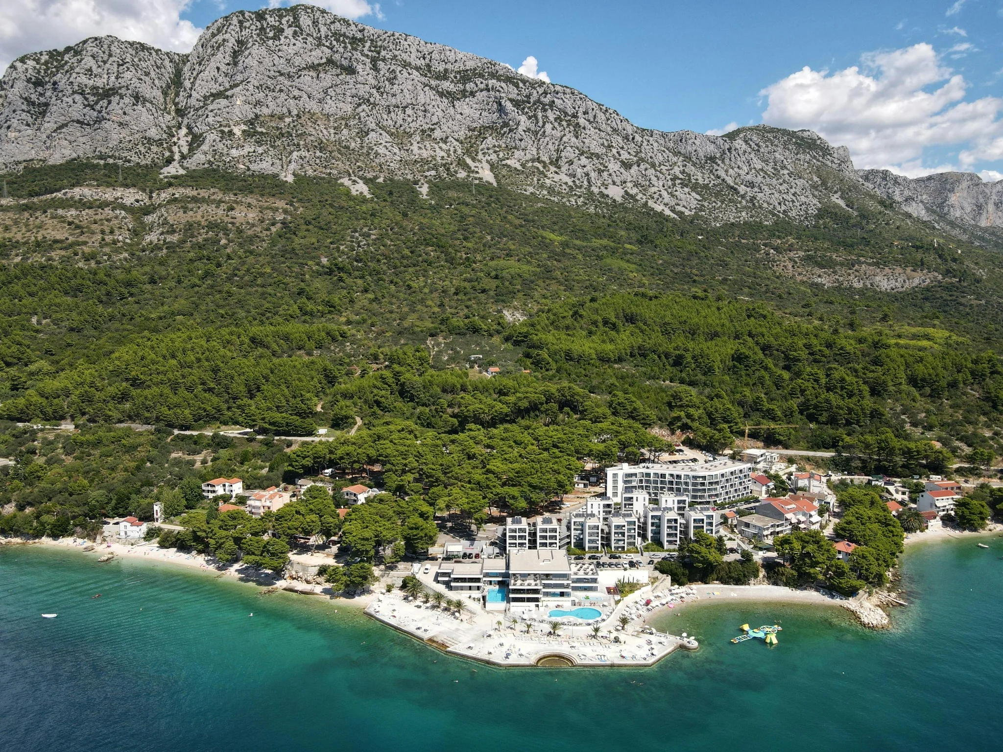 Brač's coastline below the limestone interior with Vidova Gora rising behind, Dalmatia, Croatia