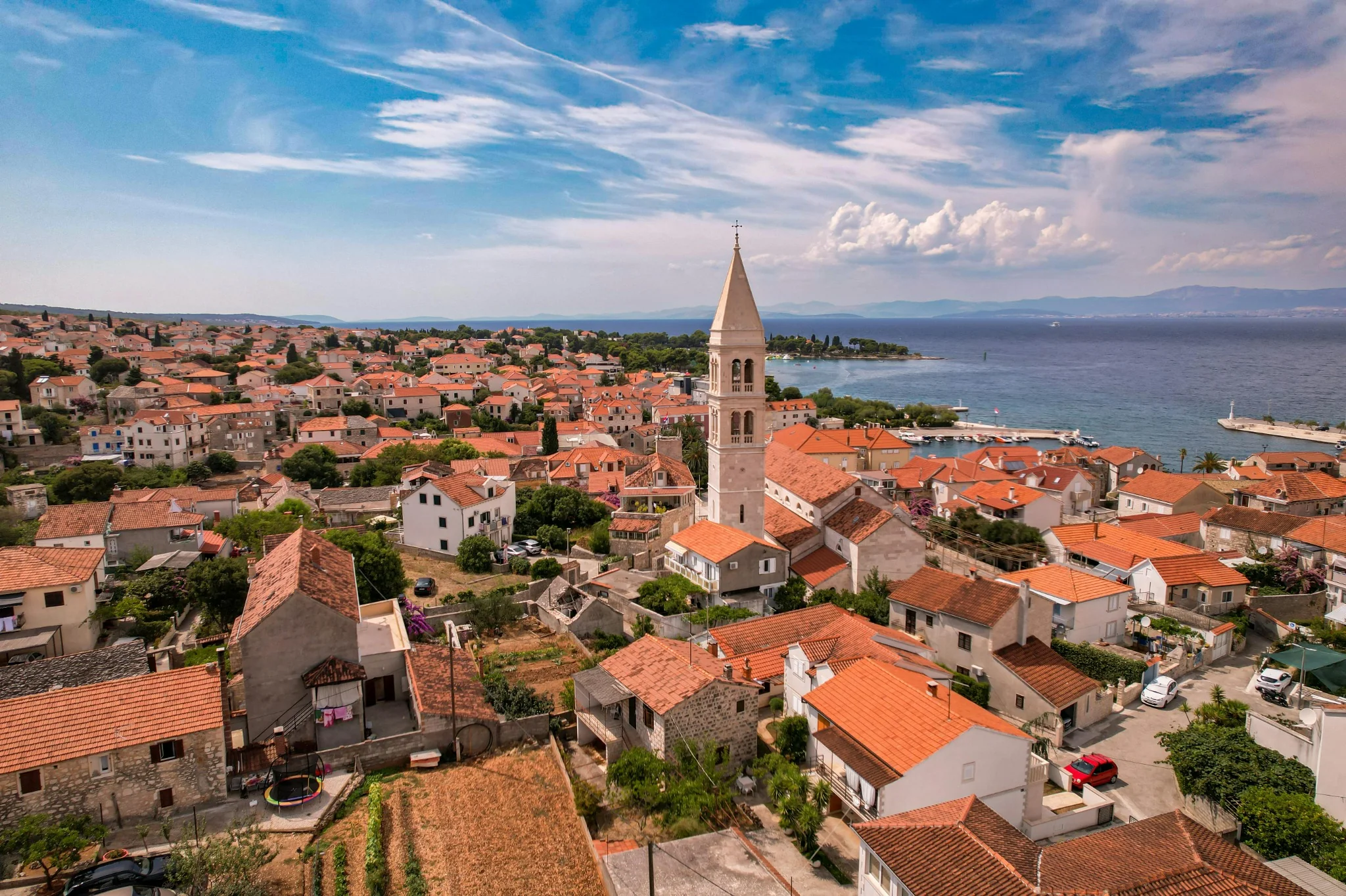 A stone village and church above the Adriatic on Brač island, Dalmatia, Croatia