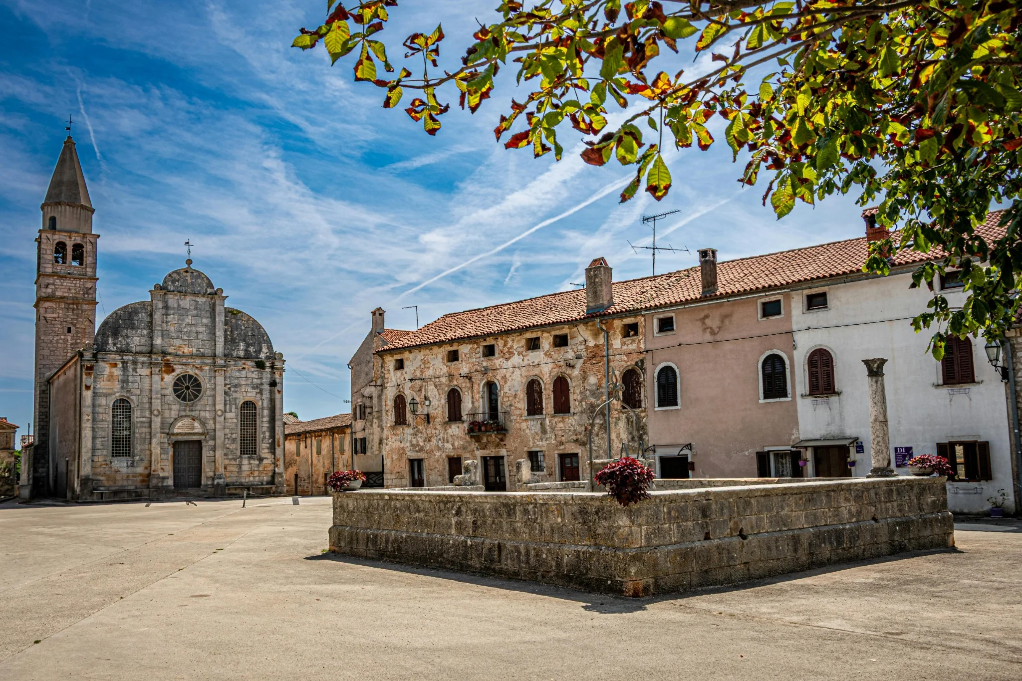 A church and main square in an Istrian hill town, inland Croatia