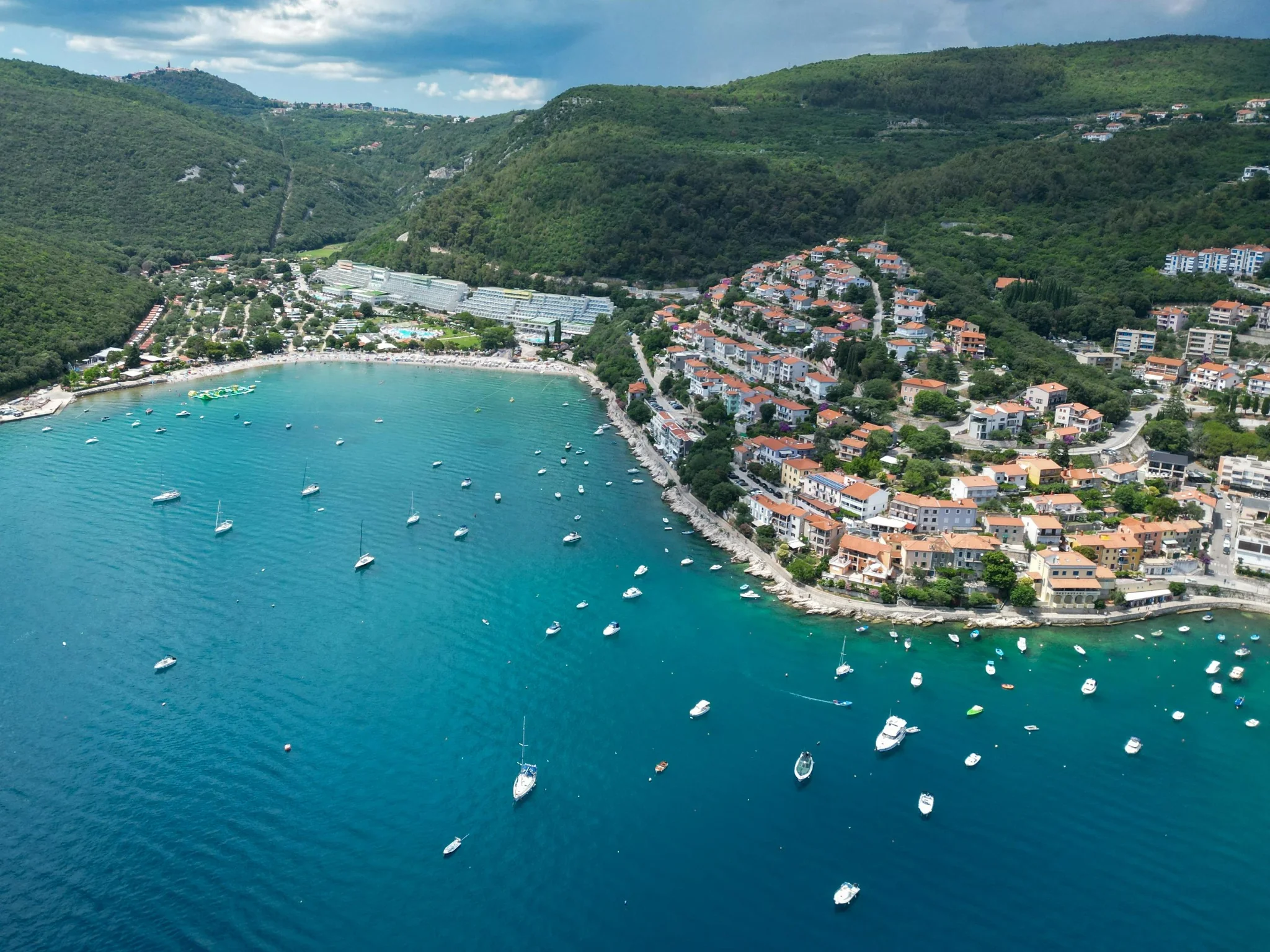 A quiet Pelješac bay with small boats moored beneath the peninsula's hills, Dalmatia, Croatia