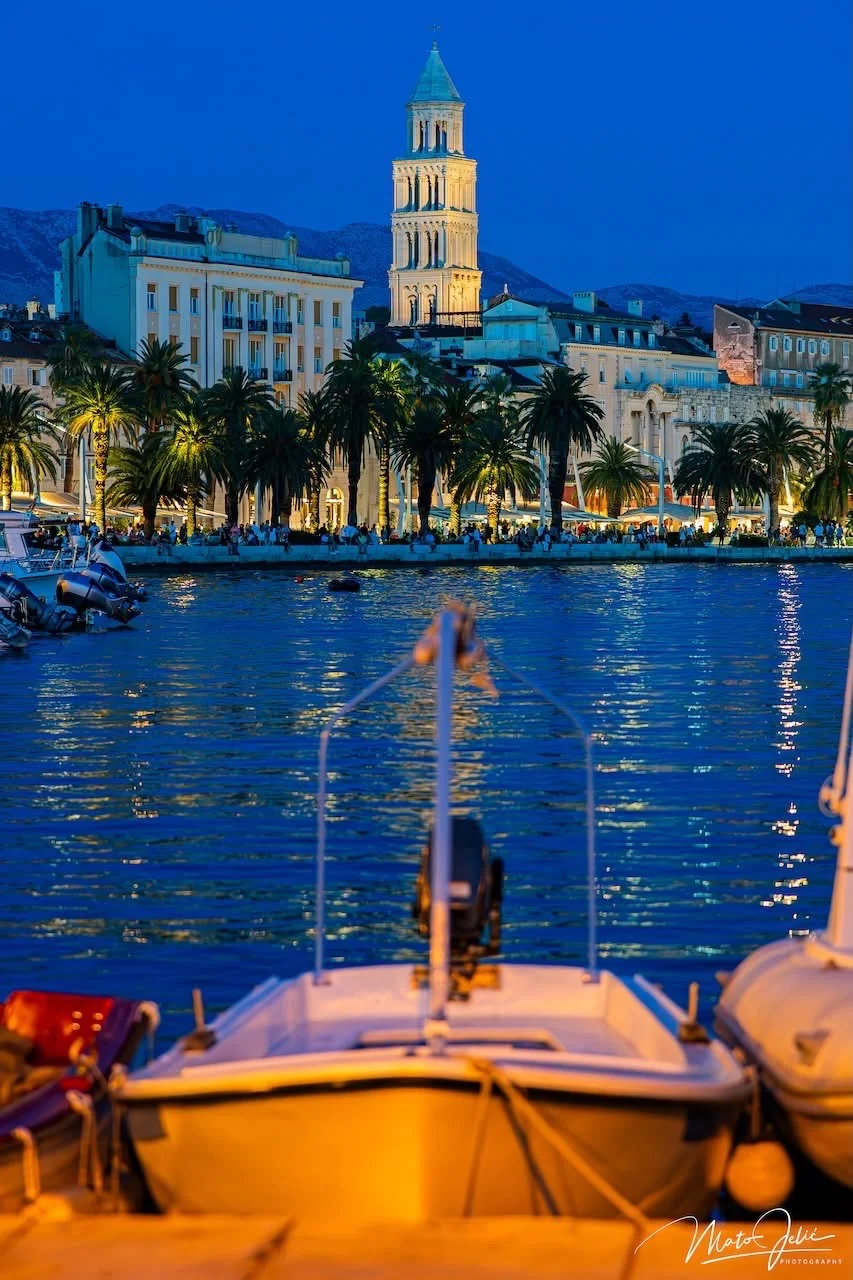 Split Riva waterfront promenade and Diocletian's Palace illuminated at night