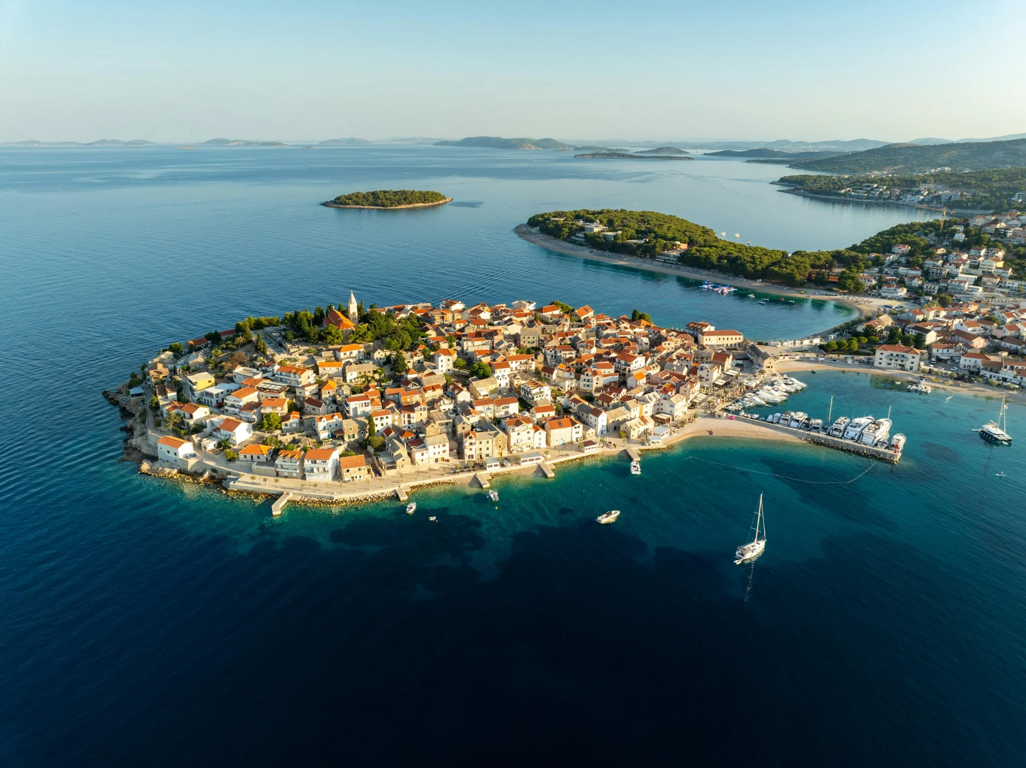 Sunset aerial view of a harbour town on Vis island in the far Adriatic, Dalmatia, Croatia